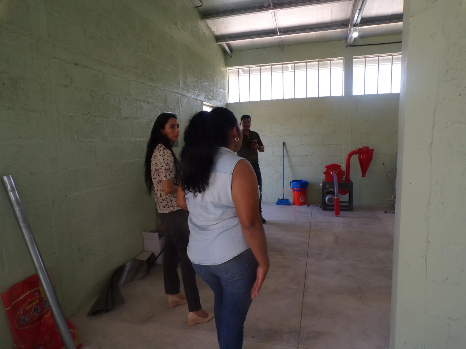 Construction crew building the feed mill at the City of Refuge